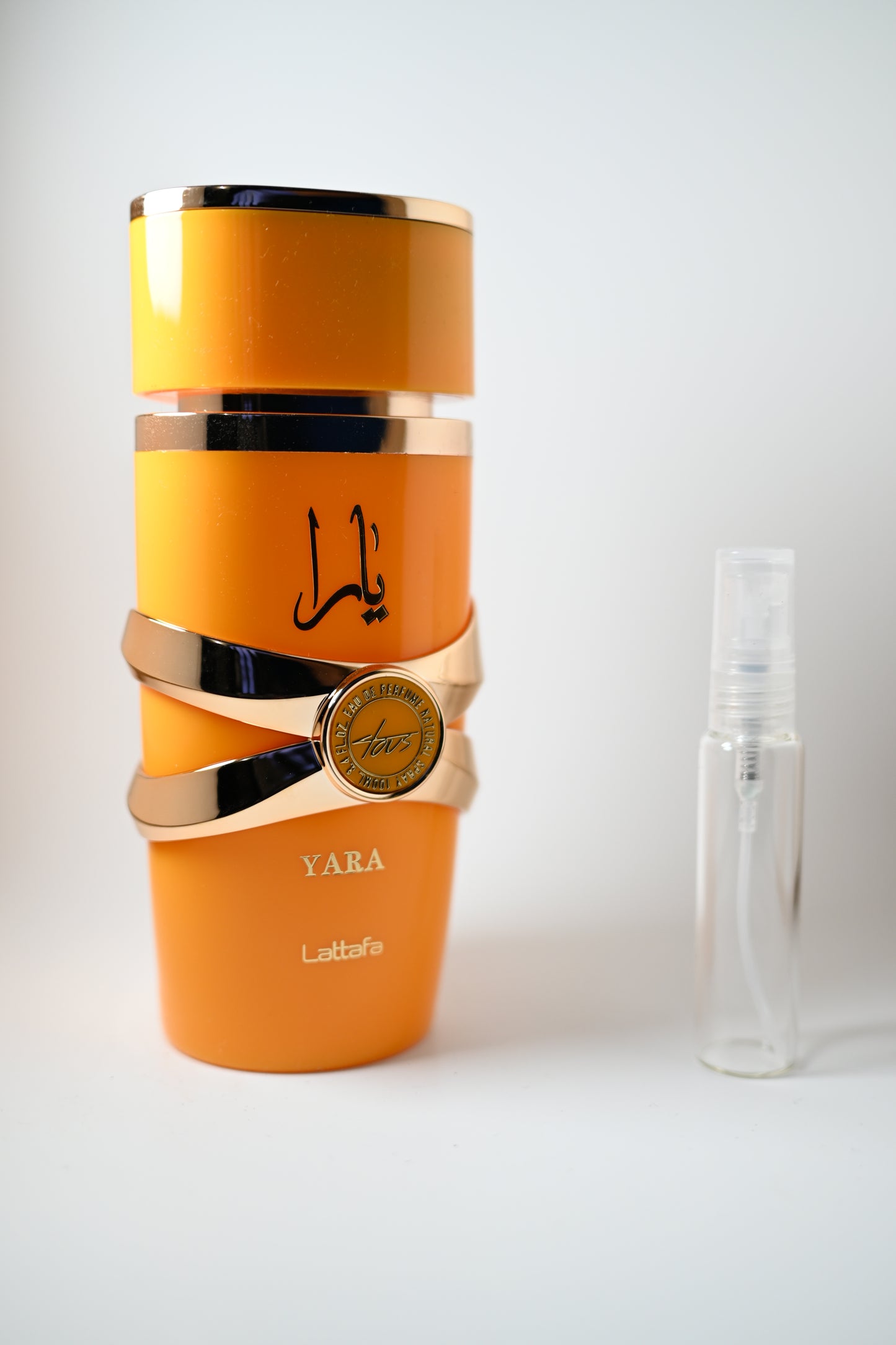 Yara Tous Bottle Next to 10ML Decant - Perfumes de Adrian