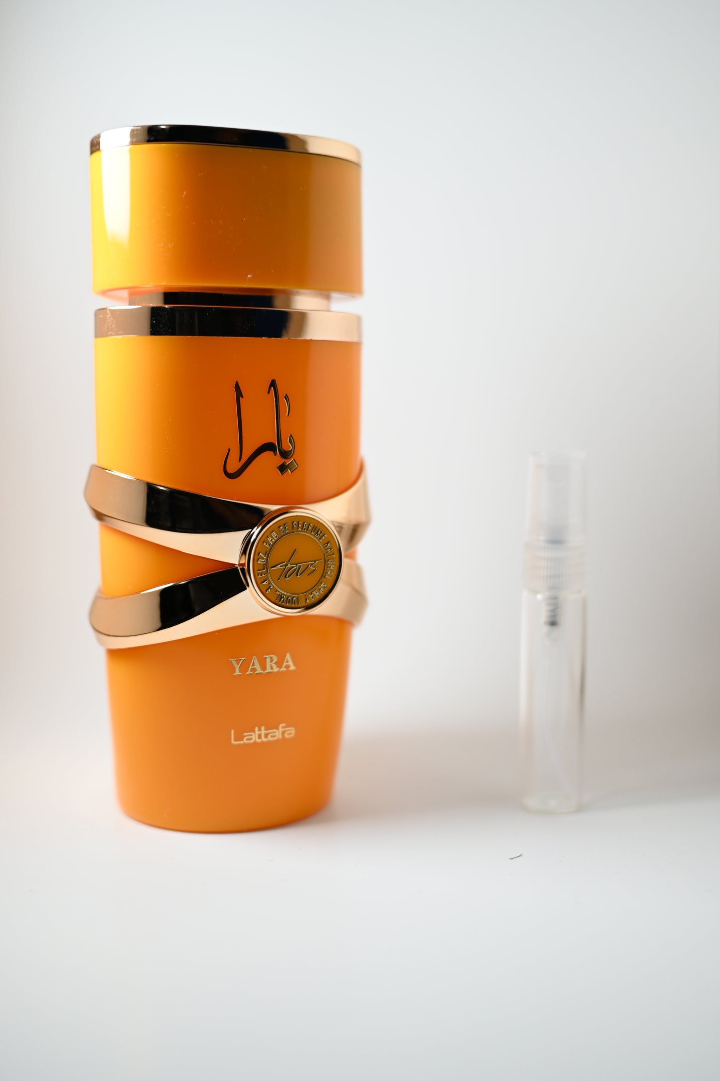 Yara Tous Bottle Next to 5ML Decant - Perfumes de Adrian