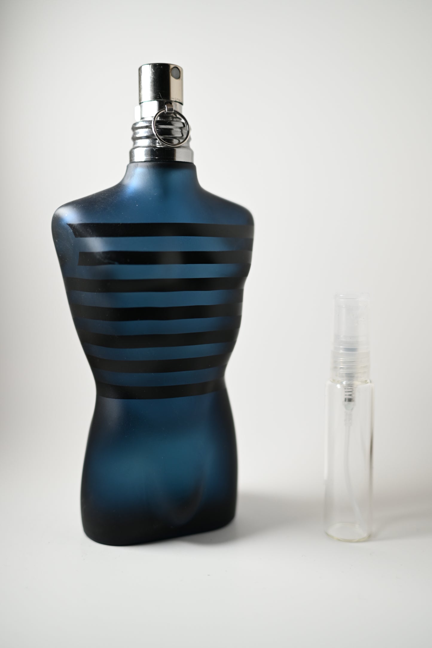 Ultra Male Jean Paul Gaultier Bottle Next to 10ML Decant - Perfumes de Adrian