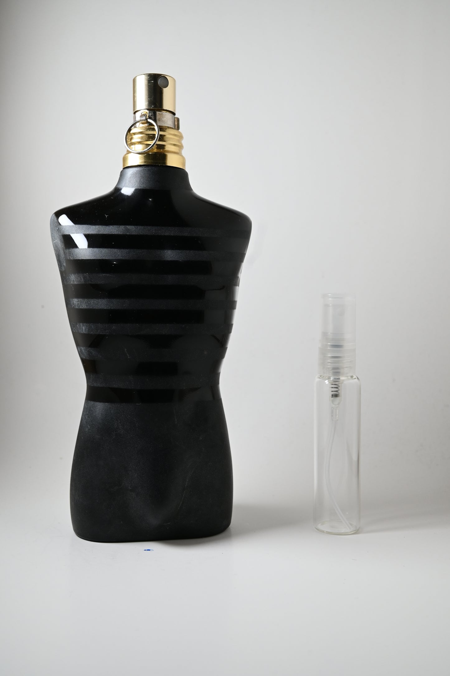 Le Male Le Parfum Jean Paul Gaultier Bottle Next to 10ML Decant - Perfumes de Adrian