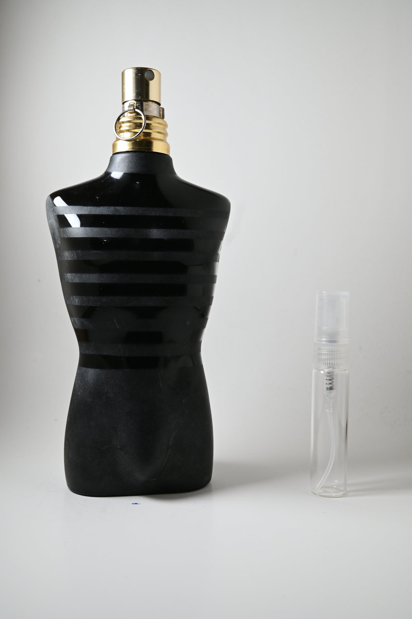 Le Male Le Parfum Jean Paul Gaultier Bottle Next to 5ML Decant - Perfumes de Adrian
