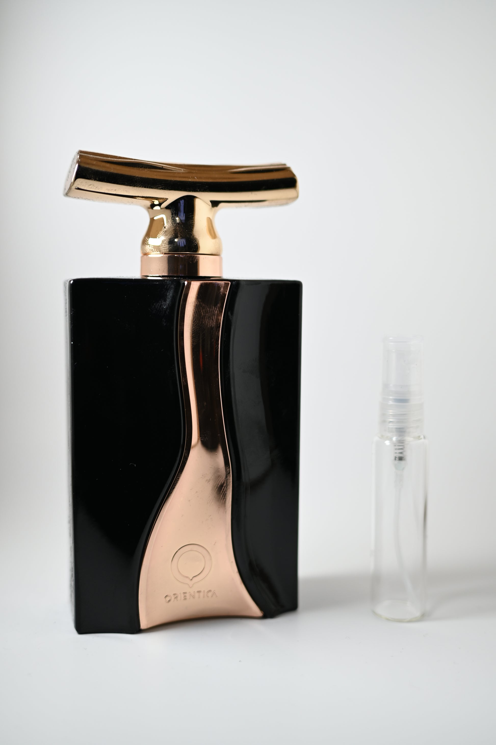 Cuir de Orientica Noir Bottle Next to 10ML Decant - Perfumes de Adrian