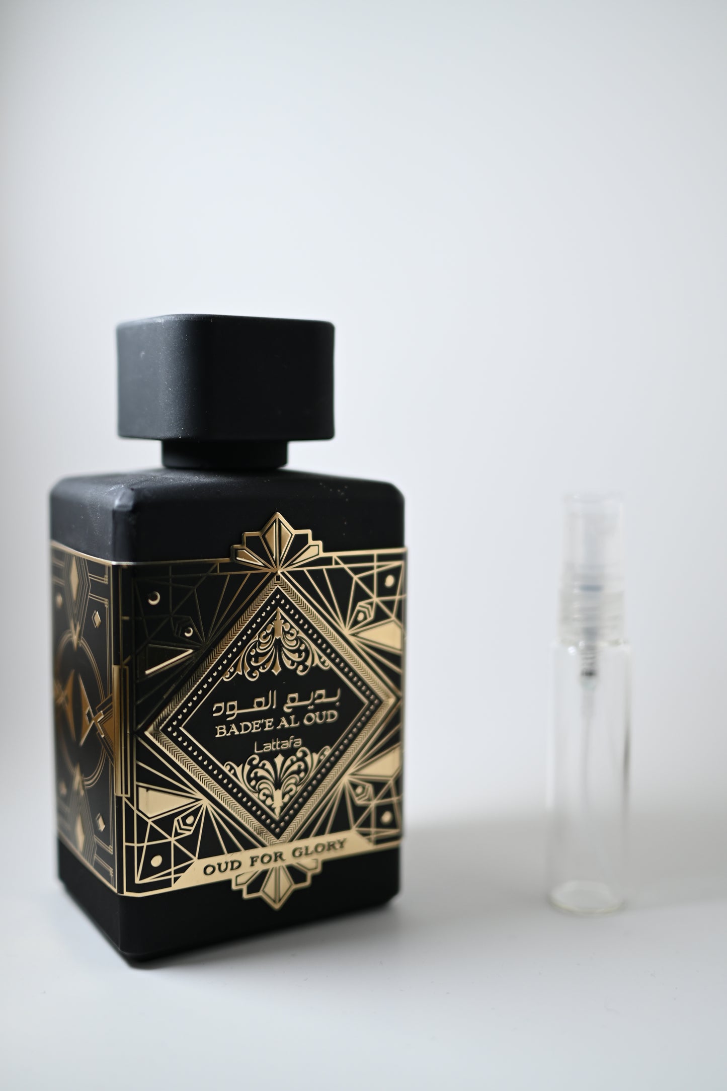 Lattafa Badee Al Oud Bottle Next to 10ML Decant - Perfumes de Adrian