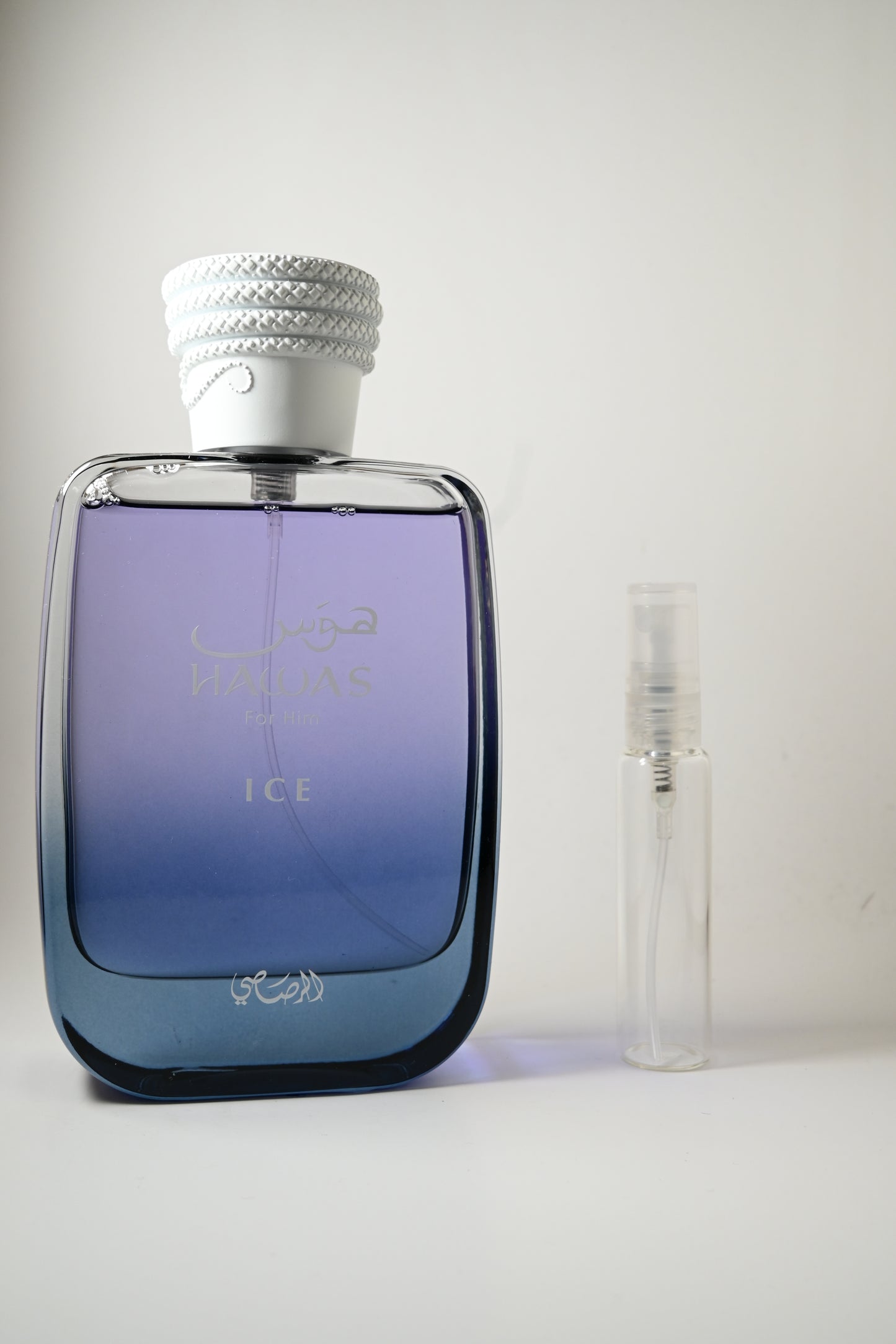 Rasasi Hawas Ice Bottle Next to 10ML Decant - Perfumes de Adrian